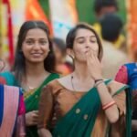 नवीन पॉलीशेट्टी और मीनाक्षी चौधरी फिल्म 'अमगनगा ओका राजू' पोस्टर।